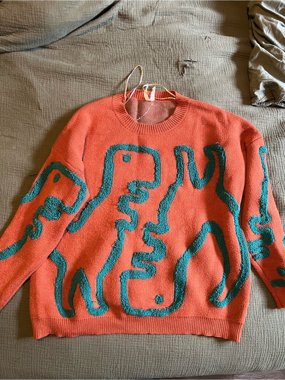 Abstract Coral Sweater with Teal Raised Pattern